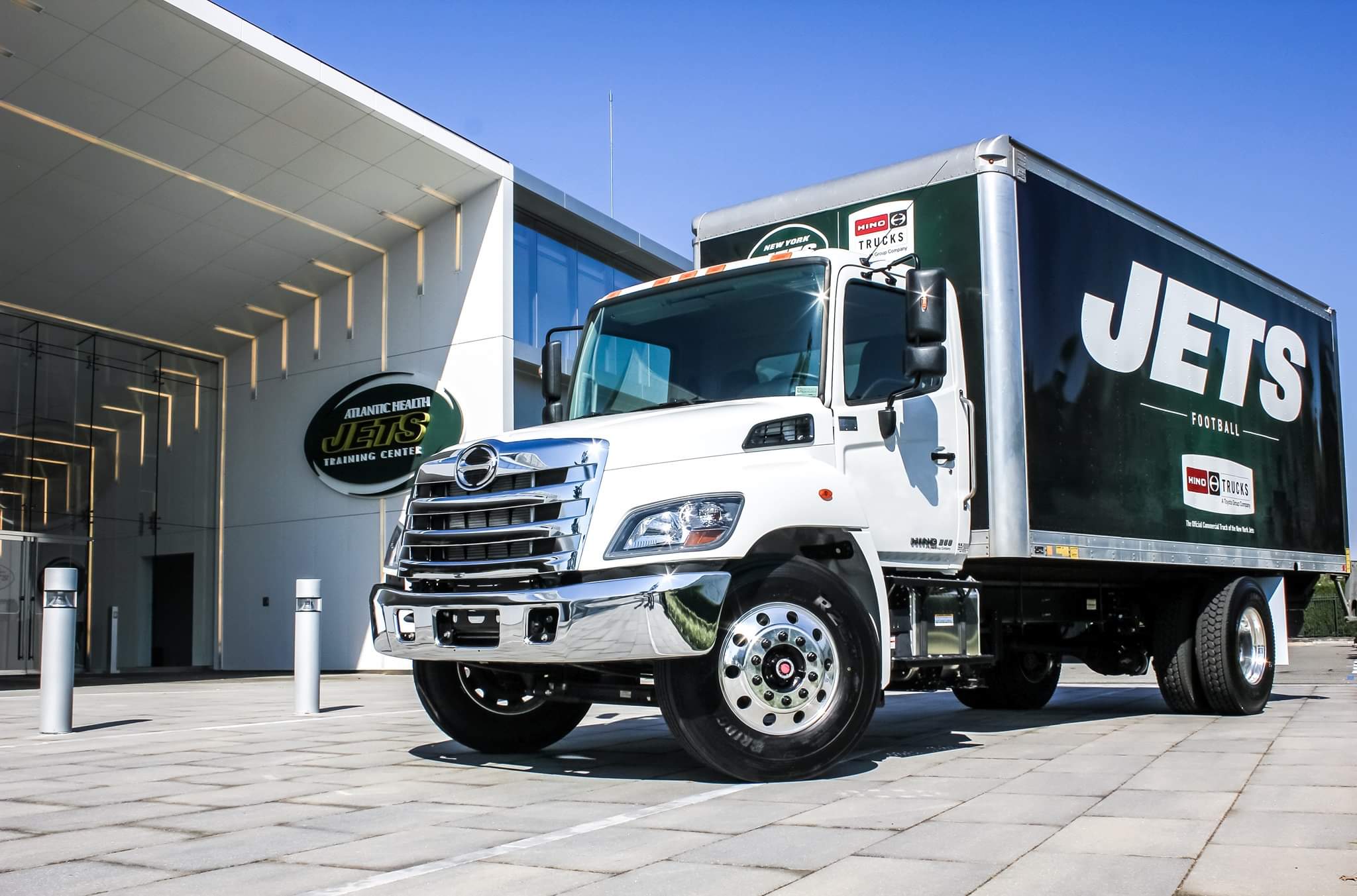 Jets truck parked in front of a headquarters